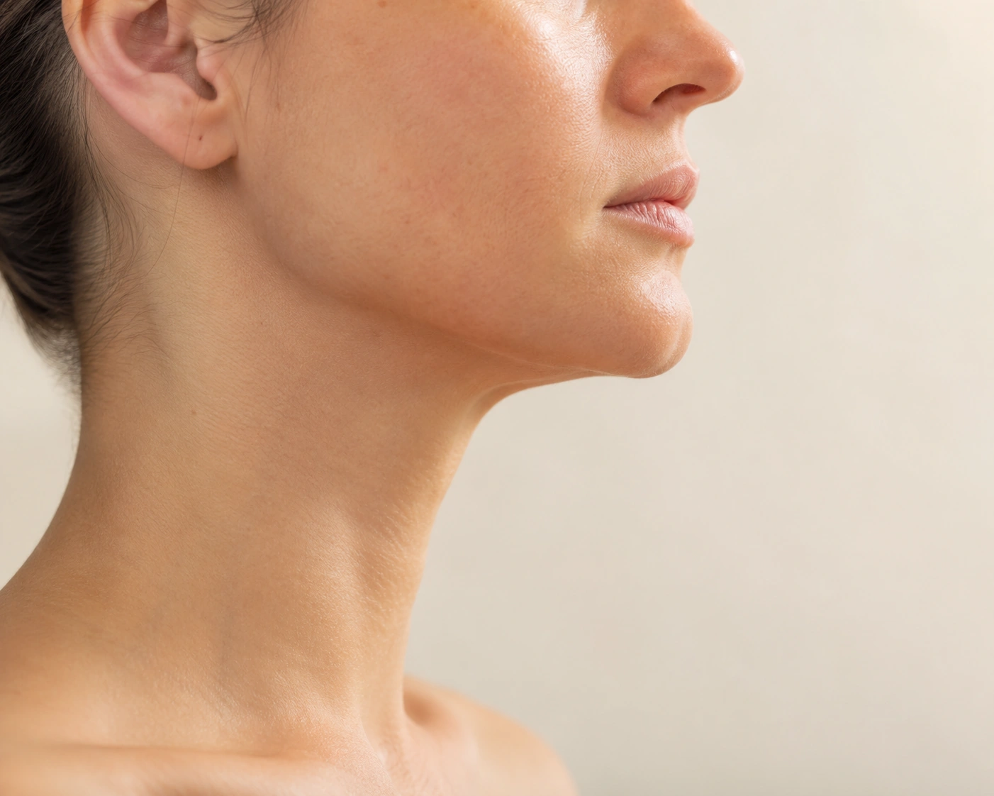 Side profile portrait showing a defined jawline and neck contour