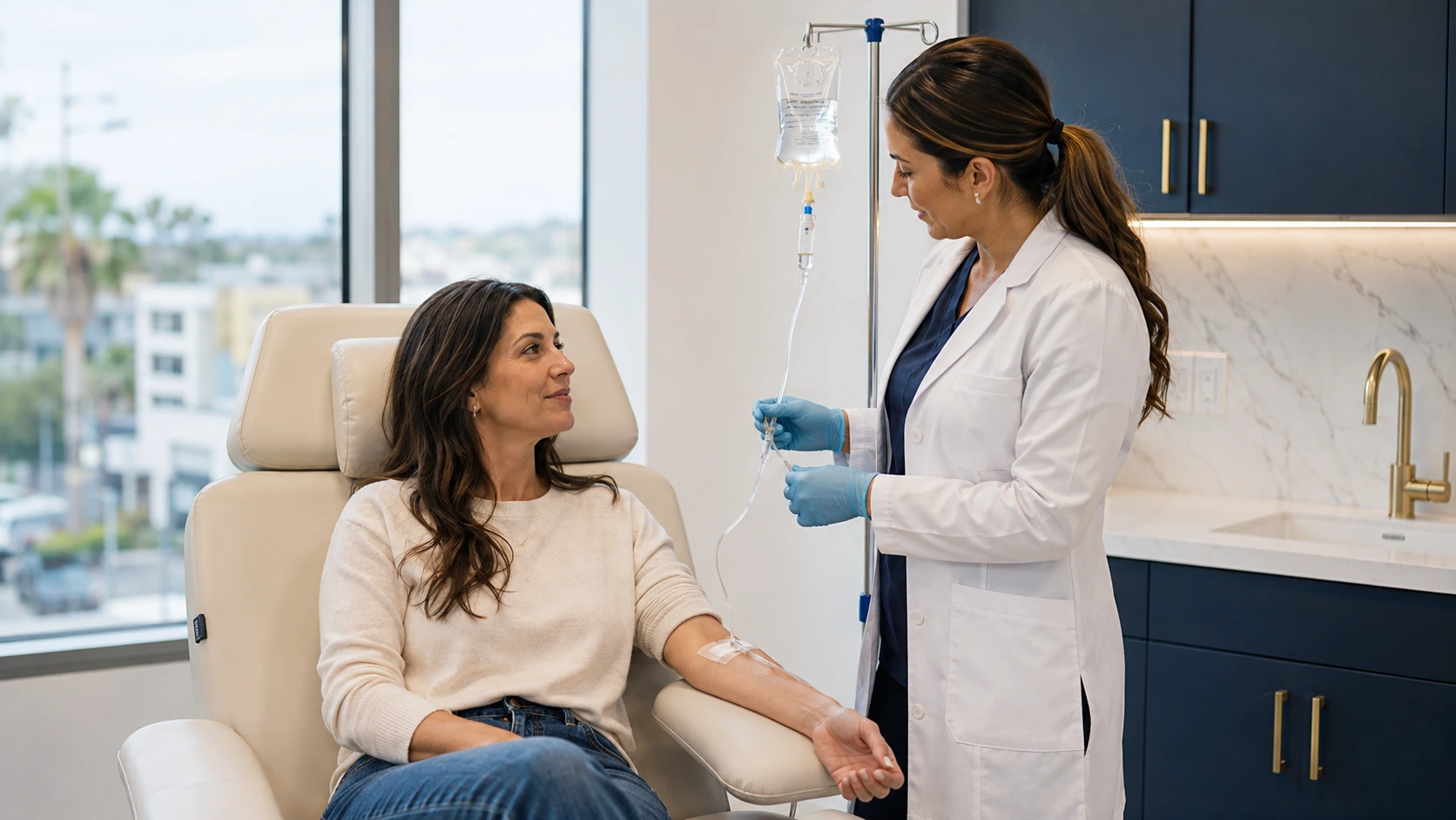 Patient receiving a vitamin IV infusion in a modern medical spa treatment room